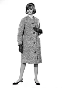 Reveille Fashions: Margaret Lorraine modeling a winter coat. August 1964 P007536