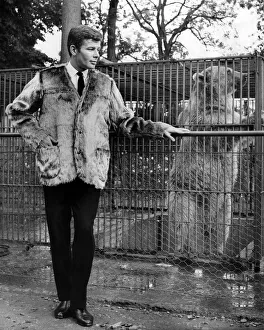 Cage Prints: Reveille Fashions: Ralph Nuttall at Chessington Zoo modelling a bear skin coat