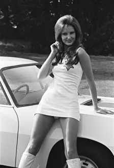 Reveille model Beulah Hughes seen here posing with a Lancia car which is a top prize in