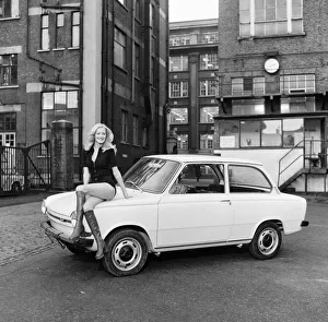 Reveille model Brooks seen here posing with a DAF 44 car which is a top prize in