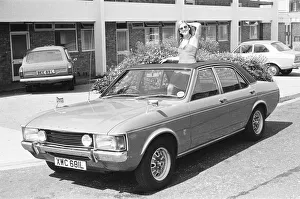 Motorcars Prints: Reveille model Caroline Cheshire seen here posing with a Ford Consul GXL car first prize