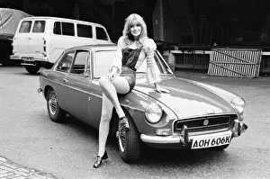 Reveille model Emma Vincent seen here posing with a MGB GT which is top prize in