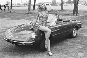 Reveille model Heidi seen here posing with an Alpha Romeo which is top prize in