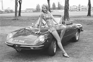 Reveille model Heidi seen here posing with an Alpha Romeo which is top prize in