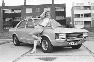Reveille model Holly Davenport seen here posing with a Ford Consul which is top prize in