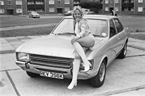 Reveille model Holly Davenport seen here posing with a Ford Consul which is top prize in
