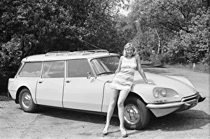 Single Woman Prints: Reveille model Jan Burdette seen here posing with a Citroen DS car which is a top prize
