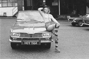 Leg Warmers Prints: Reveille model Jenny Wilson seen here posing with a Renault car which is top prize in
