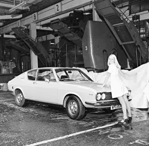 Reveille model Lynn Kaye seen here posing with a Audi Coupe 100L which is top prize in