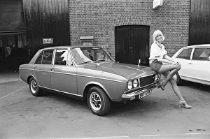 Reveille model Nancy Lee seen here posing with a Hillman Sunbeam which is top prize in