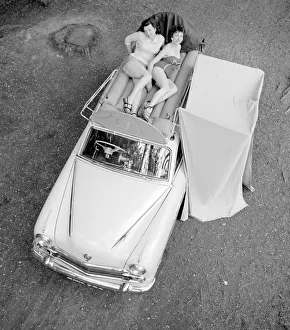 Invention Prints: Two reveille models seen here demonstrating the new car rack tent