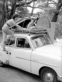 Two reveille models seen here demonstrating the new car rack tent