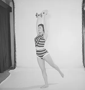 Keep Fit Prints: Reveille Keep Young and Beautiful feature, Woman wearing one piece bathing costume