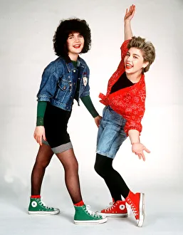 The Reynolds Girls in studio wearing shirts shorts trainers and tights