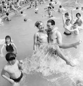 Rhyl bathing pool. Pauline Jones, 23, of Rhyl in the arms of her brother-in-law John