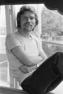 00987 Collection: Richard Branson, 28 year old mastermind behind Virgin Music company. Relaxing on his boat