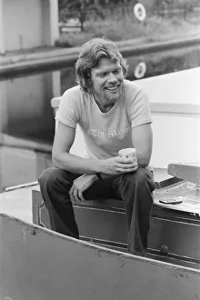 00987 Prints: Richard Branson, 28 year old mastermind behind Virgin Music company. Relaxing on his boat
