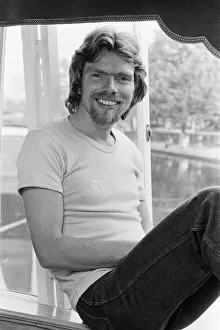 Richard Branson, 28 year old mastermind behind Virgin Music company. Relaxing on his boat