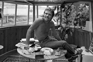 01268 Prints: Richard Branson aboard his houseboat / office at Maida Vale, London. 31st July 1982