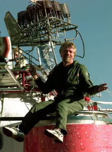 Richard Branson on top of his Balloon capsule December 1997 with a small weather test