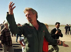 00096 Prints: Richard Branson British tycoon gestures as he arrives at a Moroccan airbase after