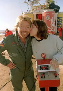 00096 Prints: Richard Branson is kissed by one of the ground crew Virgin Global Challenger balloon