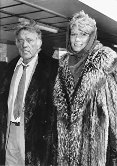 Coats Prints: Richard Burton with and his wife Susie Hunt flew in to Heathrow Airport en route to