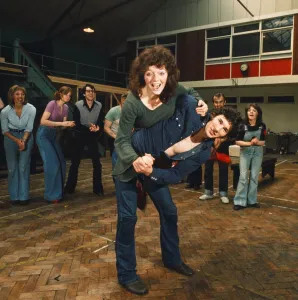 Richard Gere as Danny Zuko seen here with Stacey Gregg in rehearsal with the rest of