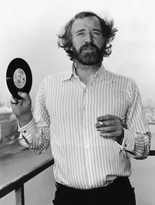 Richard Harris Irish actor holding copy of pop single 1972