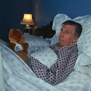 00126 Prints: Ricky Fulton in bed with Teddy Bear comedian actor October 1987