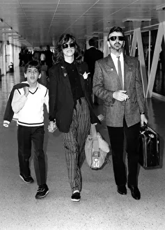 Ringo arrival. Ringo Starr arriving at Heathrow with wife Barbara Bach and her son