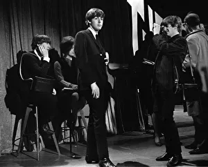 Ringo Starr taking pictures of Paul McCartney smoking in New York during the first
