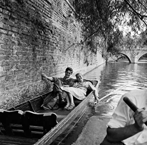 On the river Cam in Cambridge resting in a punt are James Innes of St Catherine
