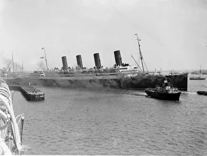 1921 Prints: RMS Aquitania seen here leaving Southampton with a crew of volunteer stewards
