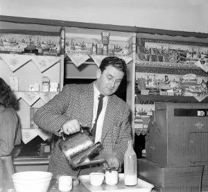 Serving Prints: Roadside CafAoe. Tea is served to coach passengers during a coach trip to Manchester