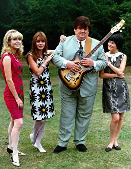 Admiration Prints: Robbie Coltrane actor standing with three women holding guitar