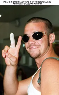 Robbie Williams arrives Glasgow Airport V sign T In The Park festival