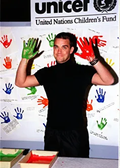 Tattoo Prints: Robbie Williams gets his hands dirty November 1999 for childrens rights