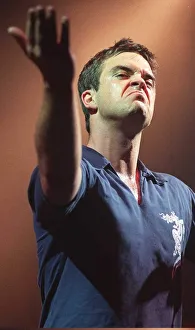 Grimace Prints: Robbie Williams makes a face to the audience at his concert at the SECC Glasgow February
