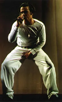 Robbie Williams of Pop Group Take That on stage during a concert in Manchester