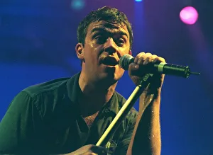 Robbie Williams sings at his concert at the SECC Glasgow February 1999