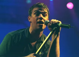 Robbie Williams sings at his concert at the SECC Glasgow February 1999