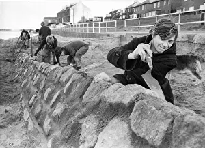 Apprentices Prints: Robert Goward, aged 19, of Hadston, Northumberland, at work on the Amble beach wall in