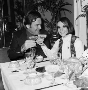 Robert Wagner and wife Natalie Wood drink champagne at the Singing Bamboo Oriental