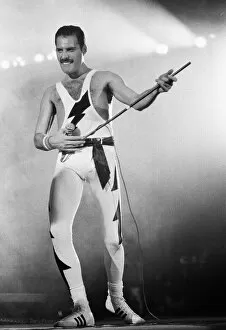 00277 Collection: Rock group Queen in concert at Wembley Arena. Lead singer Freddie Mercury