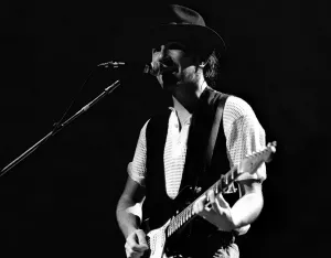 Rock group U2 in concert in USA - May 1987 The Edge singing and playing guitar