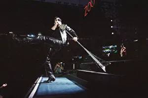 Rock group U2 performing on stage at Cardiff Arms Park led by singer Bono