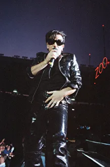 00684 Prints: Rock group U2 performing on stage at Cardiff Arms Park led by singer Bono
