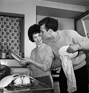 1959 Prints: Rock n Roll singer Marty Wilde and his fiance Joyce Baker making last minute