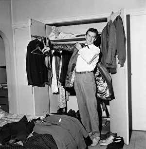 Rock and roll singer Vince Eager shows off his fabulous wardrobe. 5th April 1959